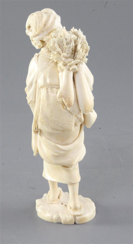 A Japanese ivory figure of a female peasant, Meiji period, height 17.5cm